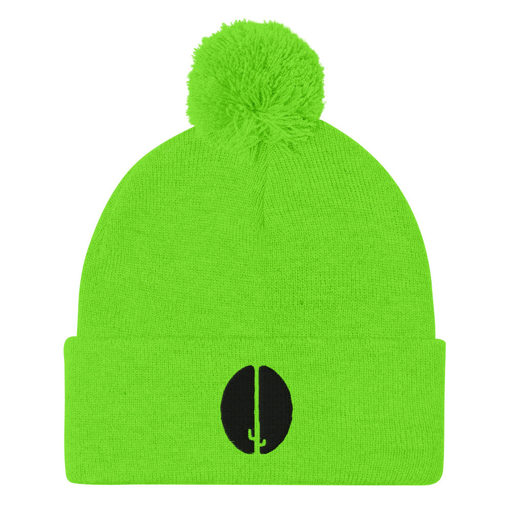 A bright green beanie with a pom-pom on top and a black saguaro bean embroidery on the front.