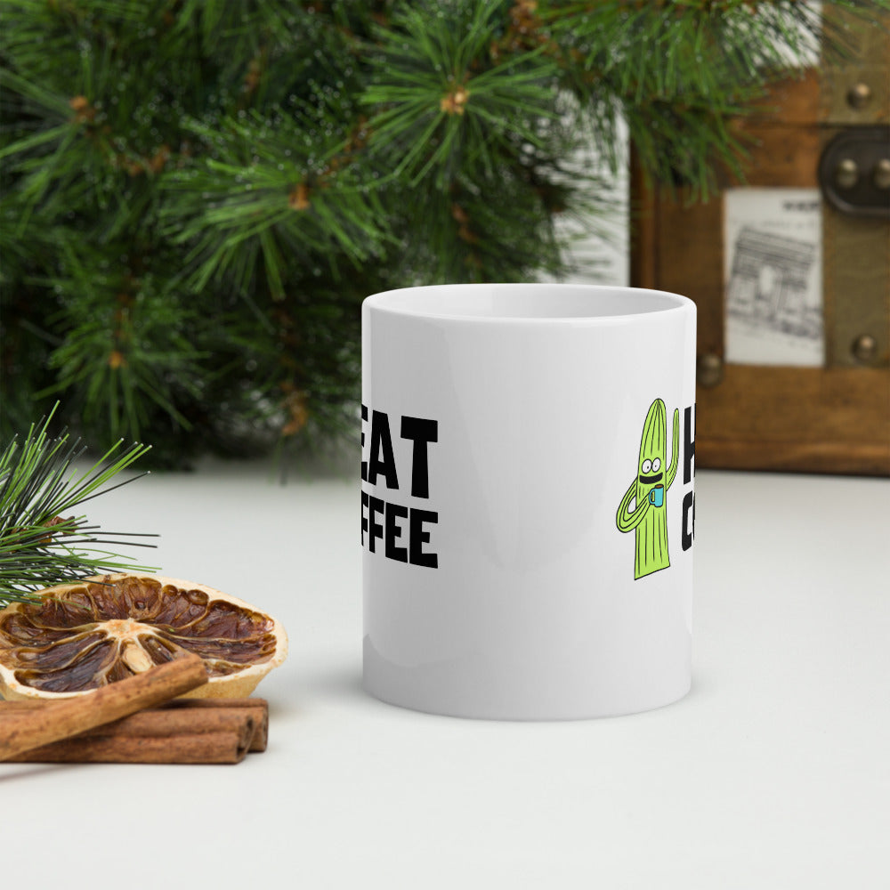 White coffee mug with Heat Coffee logo and cactus character side of mug view
